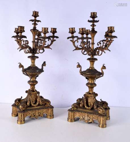 A pair of heavy gilt metal five branch candelabra. 57 cm.