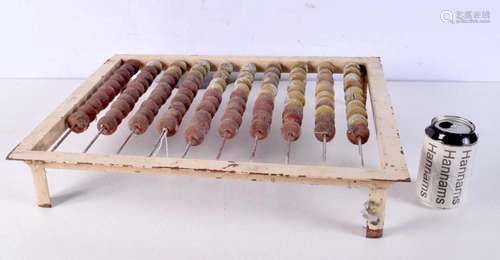 A vintage Eastern European abacus, contained within a metal ...