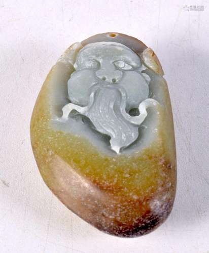 A Chinese mutton jade boulder, carved with the face of a sch...