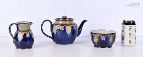 A Royal Doulton glazed pottery Teapot, jug and sugar bowl