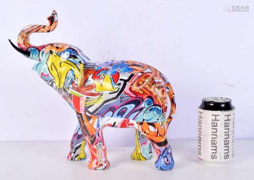 A Graffiti covered elephant statue 28 x 29 cm.