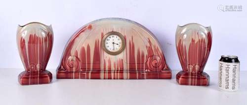 An Art Nouveau style porcelain clock set 24 x 46 cm. (3).