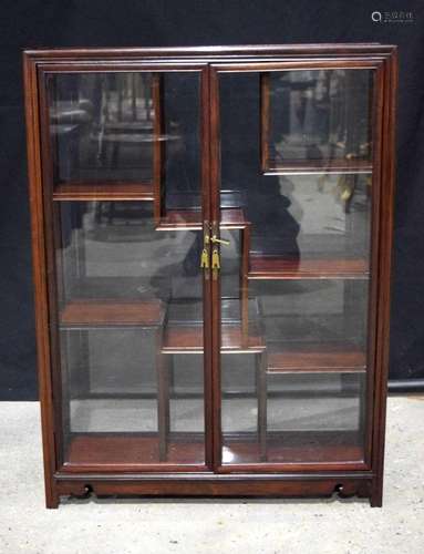 A Chinese hardwood glass display cabinet 88 x 66 x 21 cm.