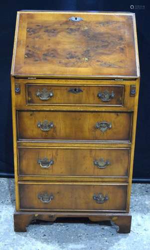 An antique 4 drawer mahogany and burr wood veneer bureau