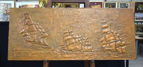 A large early 20th Century copper panel depicting sailing sh...