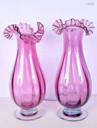 A pair of Cranberry glass vases with frilled tops .37 cm (2)...