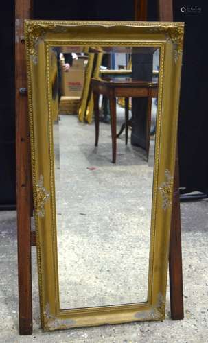 A large gilt wood framed bevelled glass mirror 105 x 46 cm.