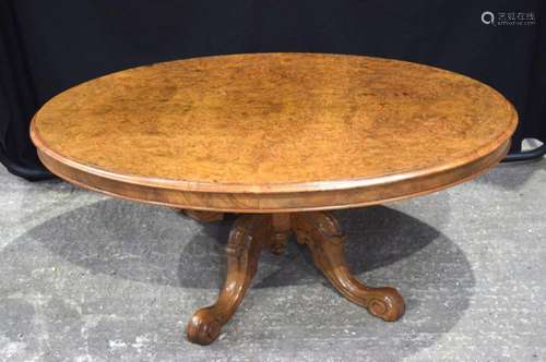 A Burr wood tilt top low table 50 x 122cm