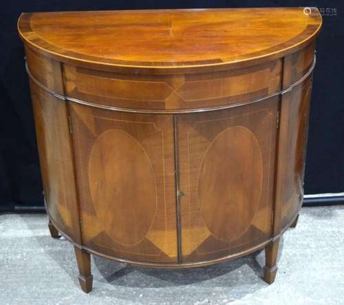 A mahogany veneered Demi lune sideboard 83 x 94 cm.