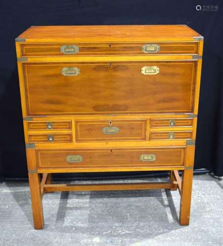 A Mid Century campaign style bureau with seven drawers 112 x...