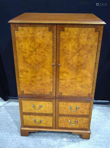 A large Burr wood cabinet with false drawer door openings .1...