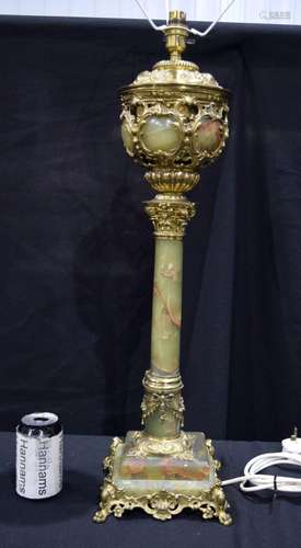 A large brass and onyx lampstand 69 cm.