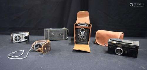 A collection of photographic equipment and cameras voigtland...