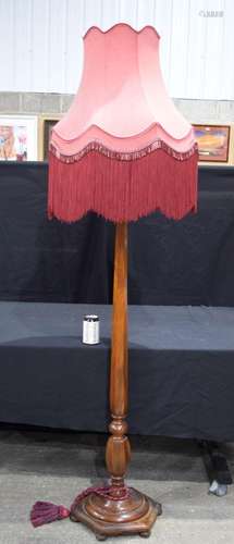 An antique carved Walnut lampstand with shade 154 cm .