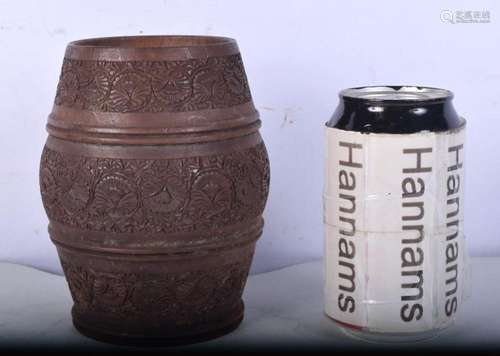 An early carved wood pot finely carved with flowers 14 cm.