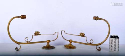 A pair of gilt metal rams head wall sconces 37 cm (2).