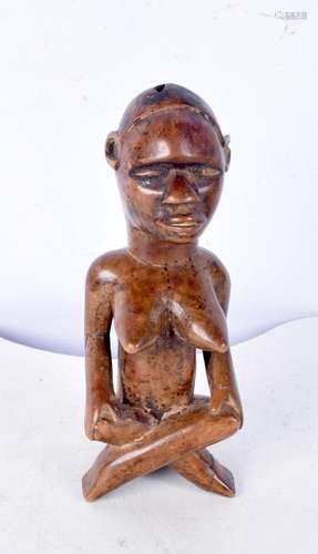 A carved wood Congolese figure 14 cm.