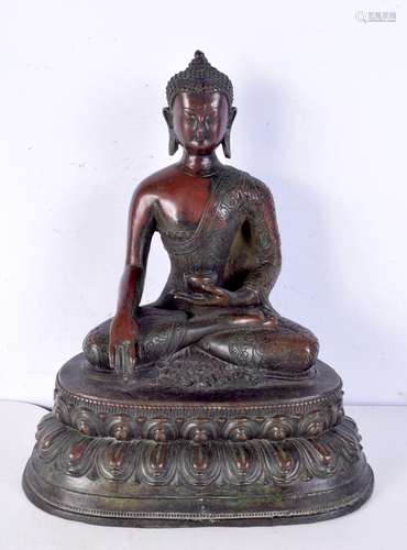 A large Chinese bronze buddha in the form of Shakyamuni, for...