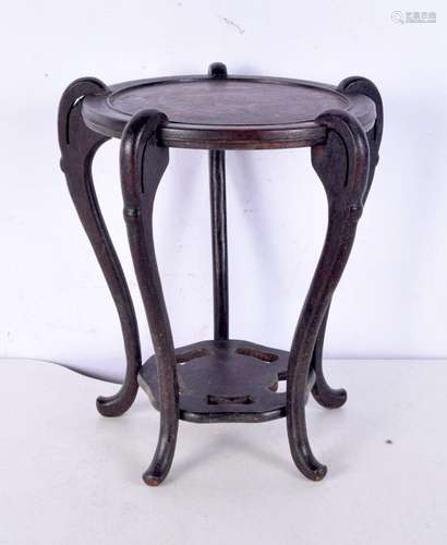 A Chinese carved hardwood stand, formed with five curving le...