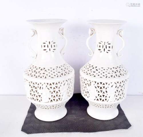 A Pair of Chinese white glazed reticulated vases, decorated ...