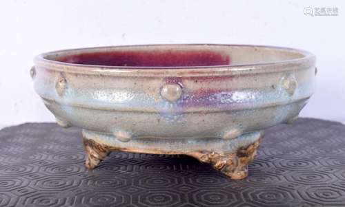 A Chinese junyao glazed pottery censer formed upon a three l...