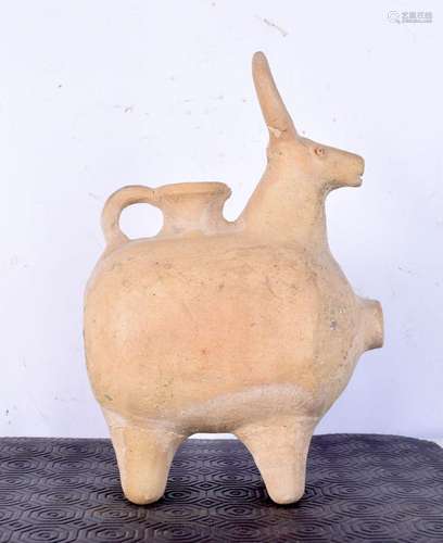 An Amlash pottery water vessel in the form of a standing bul...