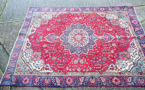 A large Persian rug 327 x 244 cm