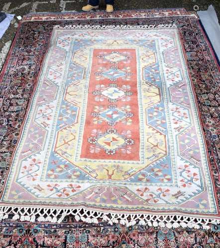 A Turkish wool rug 283 x 182 cm .