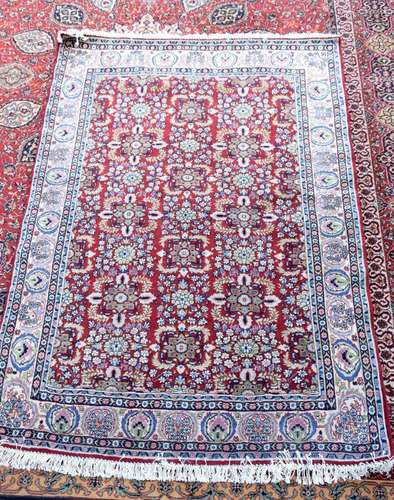 A small Persian rug 196 x 139.