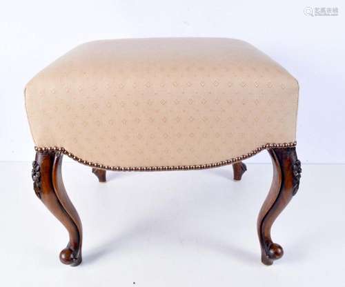 An upholstered antique stool. 44 x 46 x 48cm.