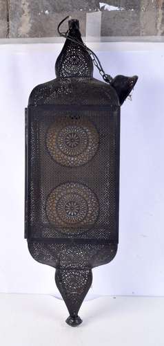 A large hanging ceiling lantern with a metal openwork Islami...