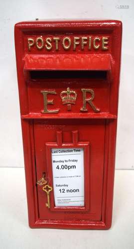 A contemporary red metal post box. 57 x 34 x 24cm.