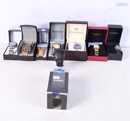 A collection of boxed fashion watches including Christian La...