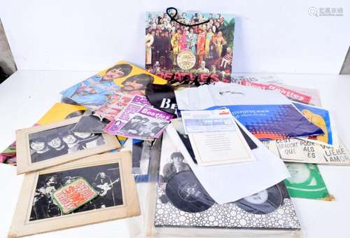 A collection of The Beatles memorabilia including a clock, C...