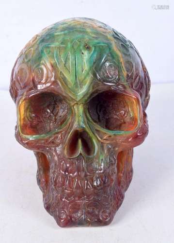 An Amber type skull. 14 x 16 x 12cm.