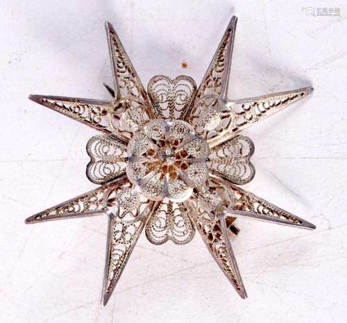 A Filigree White Metal Brooch in the form of a Star. 5cm x 5...