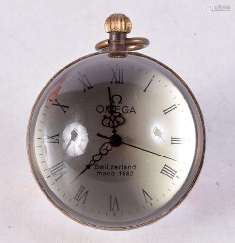 A Desk Ball Clock. 6cm diameter, runs but overwound