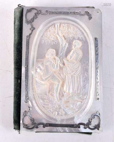 A French Aide Memoire with a carved Mother of Pearl cover an...