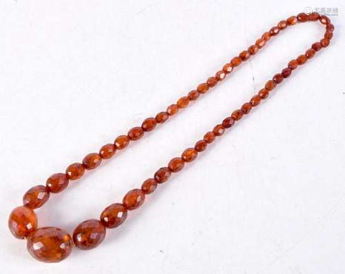 An Amber Bead Necklace. Length 58cm, weight 36g