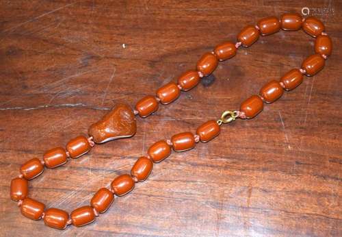 A CHERRY Amber Type Necklace. 42 grams. 46 cm long.