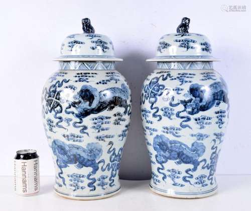 A pair of large Blue and white Baluster vases with covers de...