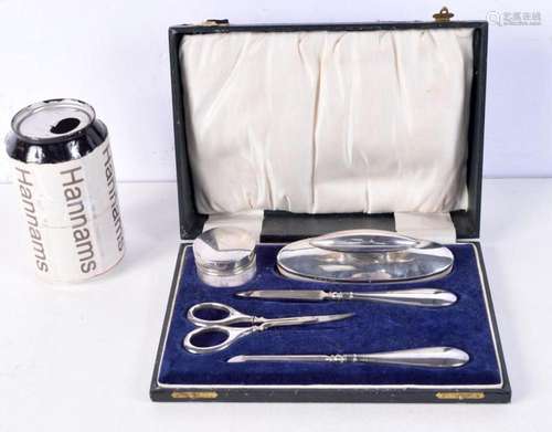 AN ART DECO SILVER MANICURE SET. Birmingham 1923. Silver 103...