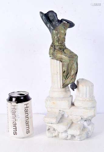 A cold painted Figure of a female sitting on Greek pillars l...