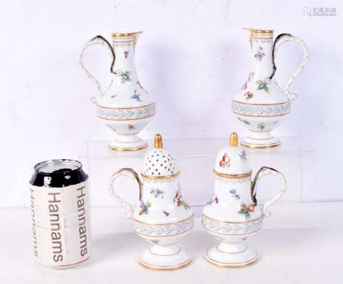 A 19th Century German porcelain jugs, sugar sifter and cream...