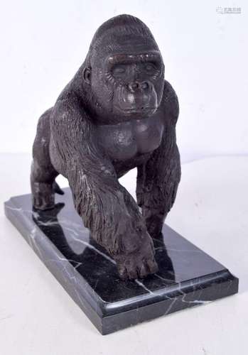 A bronze Gorilla on a marble base 18 x 20 cm.