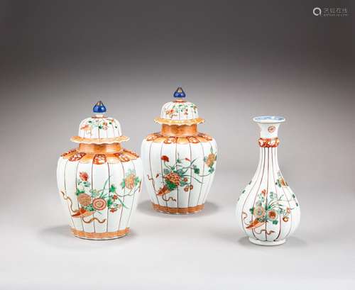 A pair of famille-verte lobed baluster vases and covers and ...