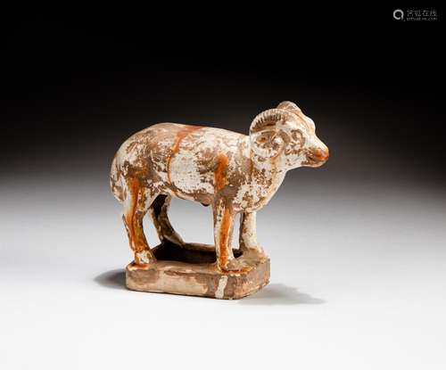 A sancai white-glazed pottery figure of a sheep with yellow ...