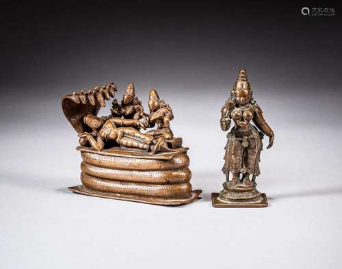 A bronze figure of Vishnu reclining on the serpent Shesha an...