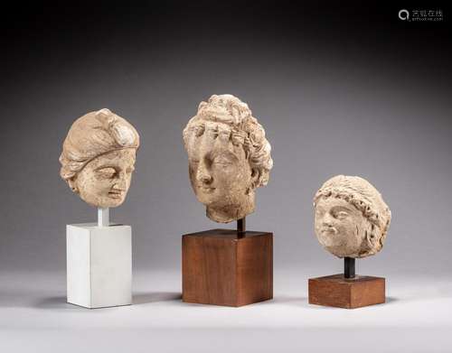 A group of three stucco heads, Gandhara, 3rd - 4th century |...