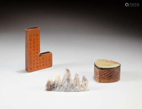 A pale celadon jade mountain-shaped brushrest and an inscrib...